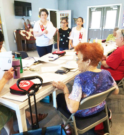 Grace Willing Workers discuss family disaster kits