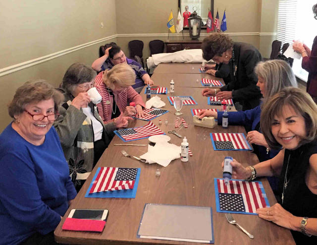 Colonial Dames make Braille flags at working meeting