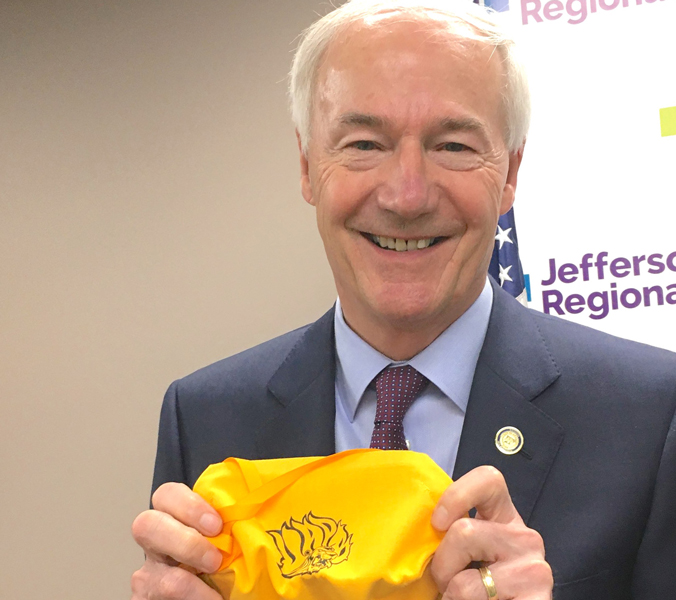 Hutchinson says decision coming on easing virus limits
