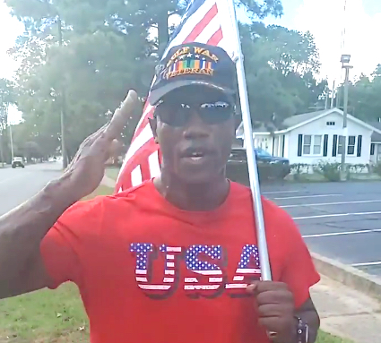 Military Hero spreads unity across Arkansas carrying flag