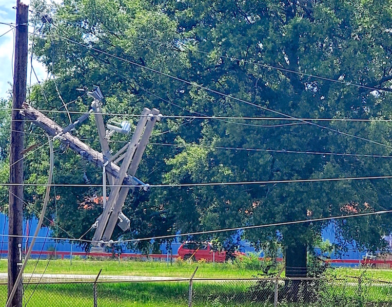 Truck driver inadvertently catches power lines