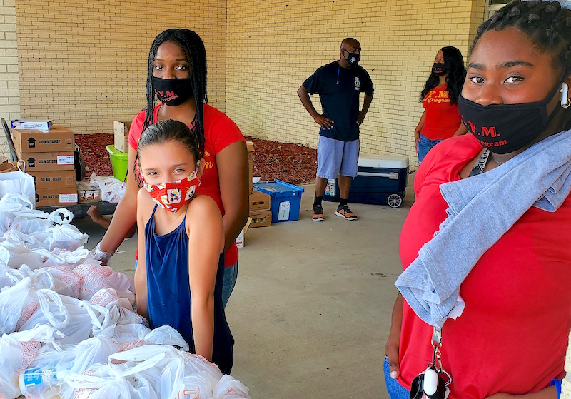 Volunteers distribute school supplies Saturday