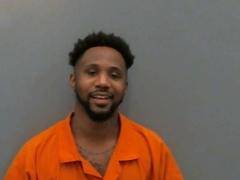 Police arrest man linked to stolen car that had been shot up