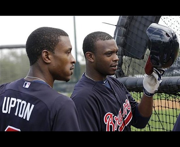 Atlanta Braves left fielder Justin Upton (L), brother B.J. Upton