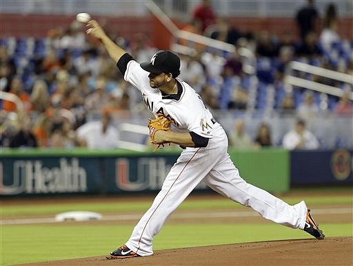 Miami Marlins shortstop Jose Iglesias throws to first during a