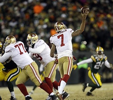 San Francisco 49ers quarterback Colin Kaepernick throws a pass during the  fourth quarter of the NFC Wildcard Playoff against the Green Bay Packers at  Lambeau Field in Green Bay, Wisconsin on January