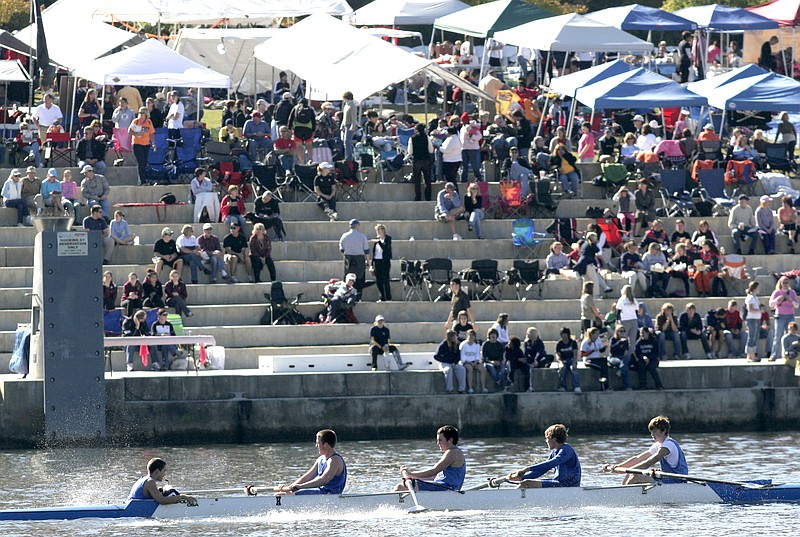 Staff Photo by Margaret Fenton
A team from McCallie School pulls across the finish line at Ross's Landing in the men's youth novice 4+ event Saturday morning at the 2008 Head of the Hooch Rowing Regatta.