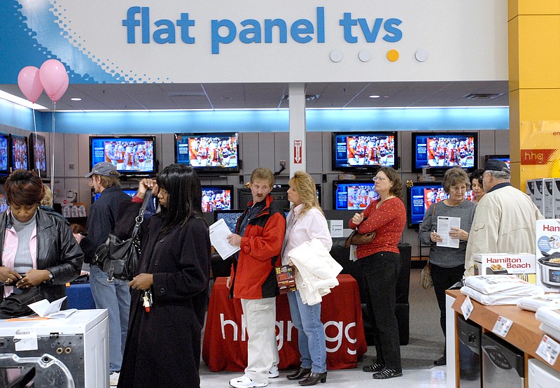 Customers wait in line at hhgregg off Shallowford road in 2008. The consumer electronics chain is going out of business and shutting down all its stores.

