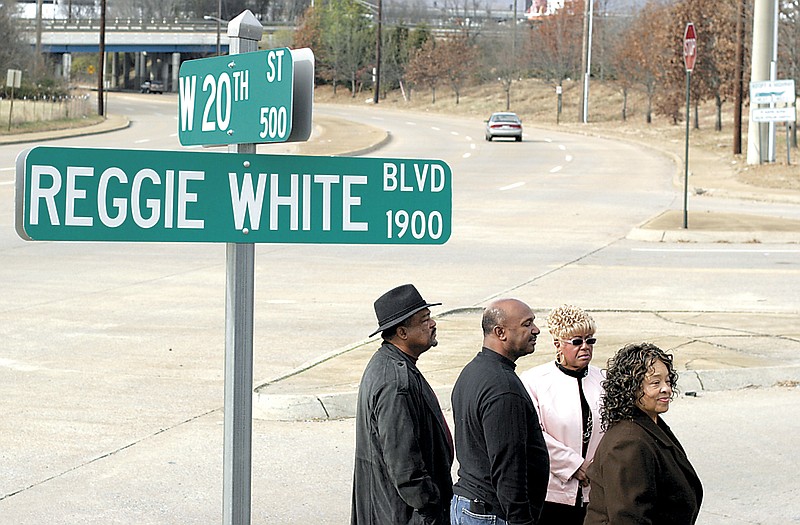 From left, Chattanooga News Chronicle CEO John L. Edwards III, Mr. White's former photographer Herman Prater Sr., Mary Adams and Mr. White's mother, Thelma Collier attend the dedication of a section of the former as Reggie White Boulevard, honoring the late defensive end who hailed from Chattanooga. 