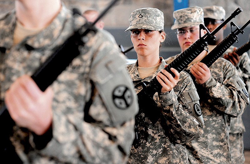 File photo - Anna Burris and other members of the Army National Guard practice drills at the National Guard Armory on Holtzclaw Avenue in 2009.