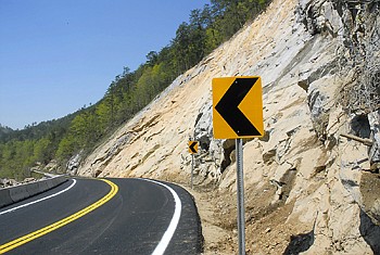 Staff photo by Tim Barber/Chattanooga Times Free Press - Looking west on U.S.Highway 64, fresh paint and a shored-up wall of rock glistens in the morning sun along the Ocoee River were the road reopened at 11:15 a.m. on Wednesday, Apr. 14, 2010.