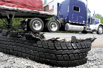 Staff Photo by Angela Lewis/Chattanooga Times Free Press 
Tire treads lie on the side of I-75 near mile marker 338 n Georgia Friday afternoon.