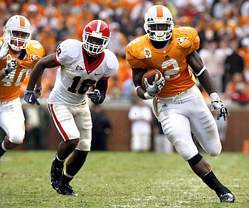 Tennessee's Montario Hardesty (2) outruns Georgia's Bacarri Rambo (18) during the second half of an NCAA college football game Saturday, Oct. 10, 2009 in Knoxville, Tenn. Tennessee won 45-19. (AP Photo/Wade Payne)