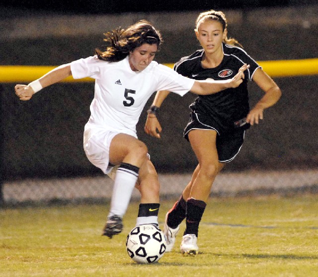 Staff photo by Tim Barber/Chattanooga Times Free Press -- Sep 14, 2010 - Notre Dame's Kathryn Healy (5) controls the ball as Signal Mountain's Lauren Blevins, right, approaches late in first half action at Notre Dame on Tuesday.