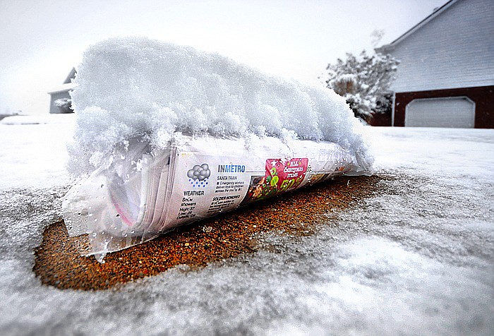 In this Dec. 25, 2010, staff file photo, four inches of Christmas morning snow covers the newspaper on this Soddy-Daisy delivery.