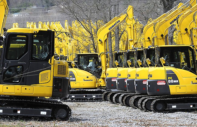 A Komatsu America employee parks a new piece heavy equipment on the yard Monday at the Chattanooga manufacturing plant. Komatsu employs more than 200 people at the Signal Mountain Road facility.
Staff Photo by Tim Barber/Chattanooga Times Free Press