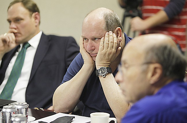 David Ashburn, center, listens to discussions during a 2011 meeting of Hospital Authority trustees. The meeting covered many of the hospital's current issues.
Staff photo by Jake Daniels/Chattanooga Times Free Press