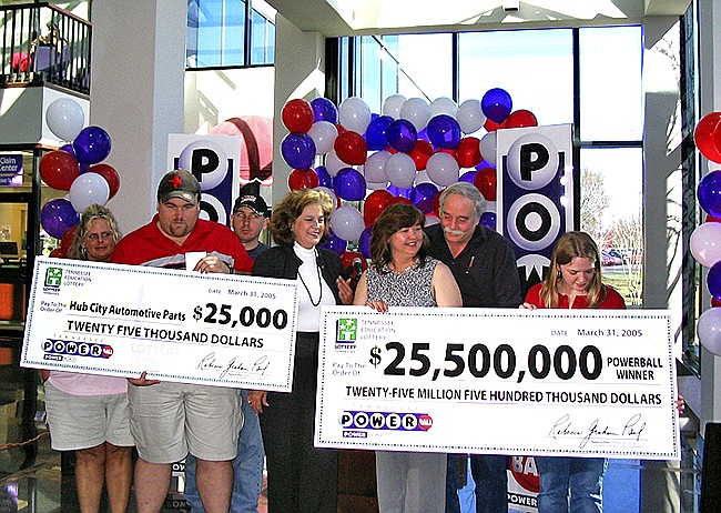 Bobbi Hubbard of South Pittsburg, Tenn., accepts a check as the all-time big Powerball winner in Tennessee in 2005. Her husband Richie is behind her and other family members are elsewhere in the photo. State lottery head Rebecca Hargrove is next to Hubbard.
AP File Photo/Tennessee Lottery