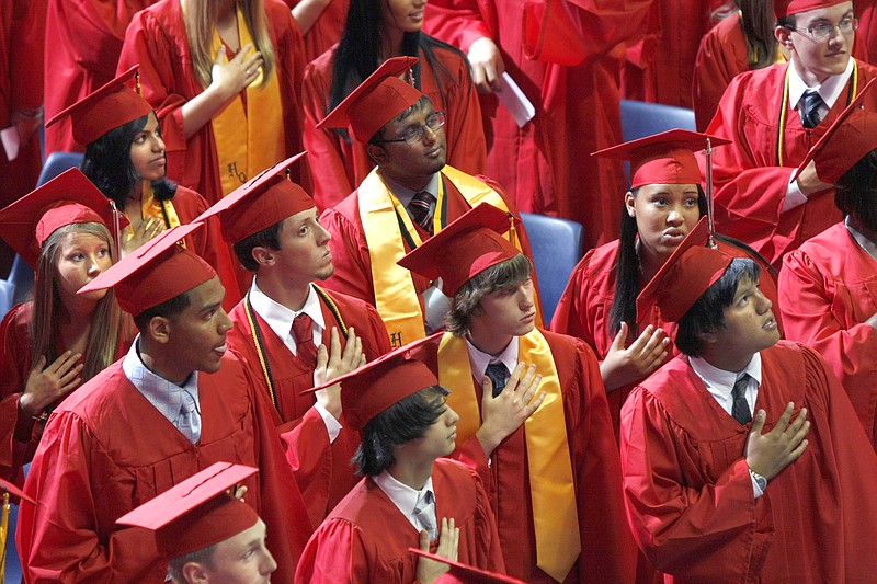 Ooltewah High School seniors say the Pledge of Allegiance during their graduation ceremony at Memorial Auditorium in 2011. The graduating class included more than 250 students. 