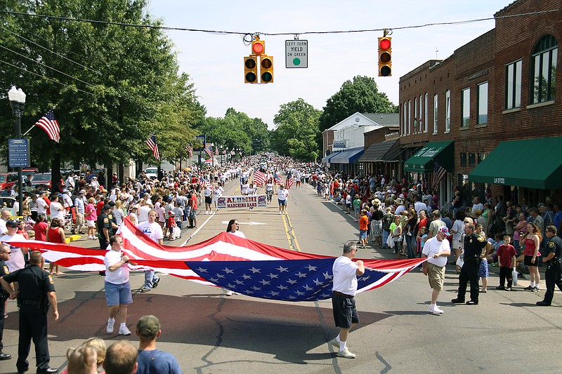 A previous Fourth of July parade passes through downtown Dunlap, Tenn.