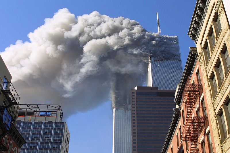 The twin towers of the World Trade Center burn after hijacked planes crashed into them in New York on September 11, 2001.