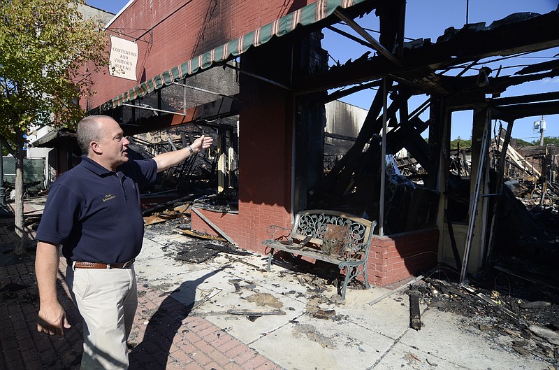 Dalton, Ga., Fire Chief Bruce Satterfield talks on October 14, 2011, about the fire that destroyed several business in Peacock Alley.