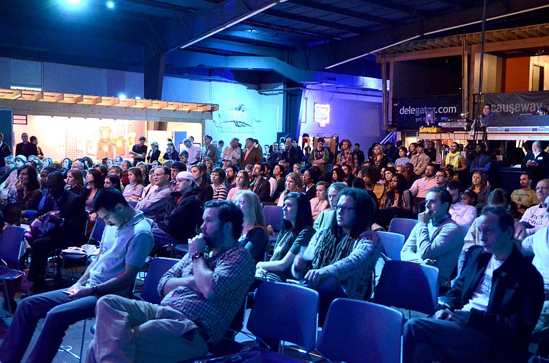 The audience listens to presentations at the demo night for 48Hour Launch Chattanooga, where hopeful entrepreneurs give a pitch for their business ideas at Track 29.