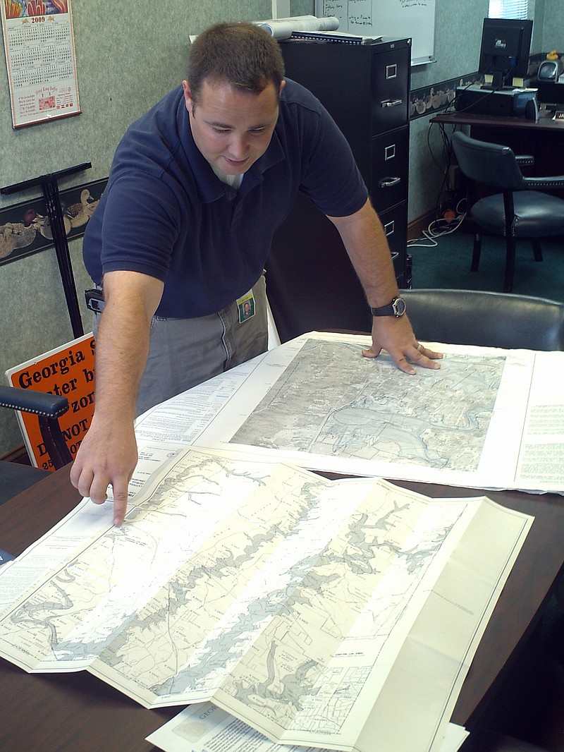 Catoosa County Stormwater Director James Davis points out details in satellite-based flood maps for the county in this file photo.