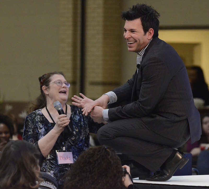 Celebrity wedding planner David Tutera laughs as he is asked a question by Connie Sanders at the Formal Affair event Sunday at the Chattanooga Convention Center. She is planning an event for her upcoming 50th wedding anniversary. The event was sponsored by the Chattanooga Times Free Press.