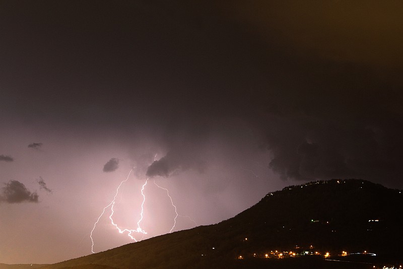 Lightning strikes south of Lookout Mountain as severe weather moves through the Chattanooga area late Friday evening.