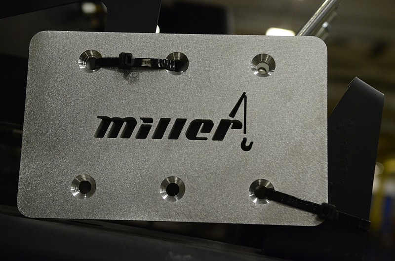 The logo of Miller Industries is seen on a component.