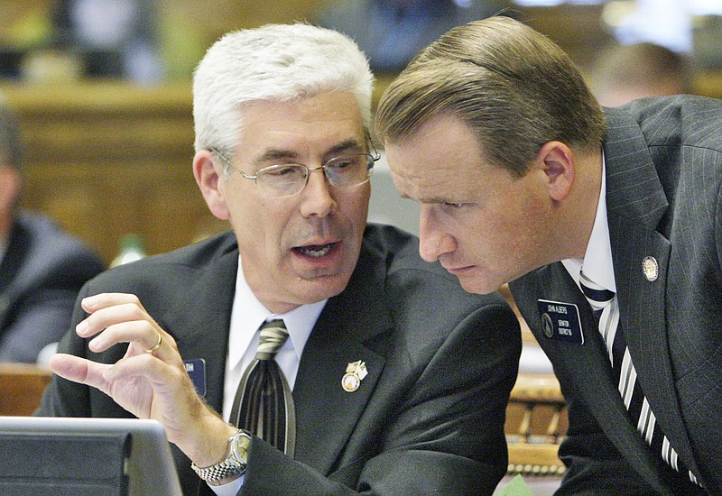 State Sen. Bill Heath and Sen. John Albers confer during a legislative session in Atlanta. / Associated Press photo