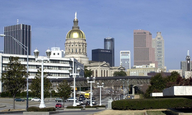 Gleaming in the sun, the gold-covered dome of the Georgia State Capitol building stands out against the skyline of the southern side of downtown Atlanta.