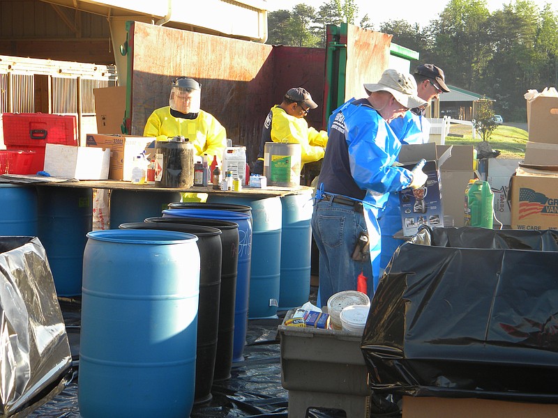 Crews and volunteers from Clear Harbors Environmental Services, Santek Environmental, Keep America Beautiful of Cleveland/Bradley County check out the paint, paint thinners, cleaning chemicals and other items brought to the annual Household Hazardous Waste Collection Day in Bradley County.