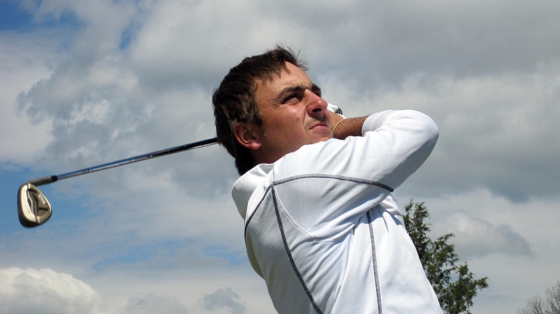 UTC junior Stephan Jaeger practices a few iron shots.