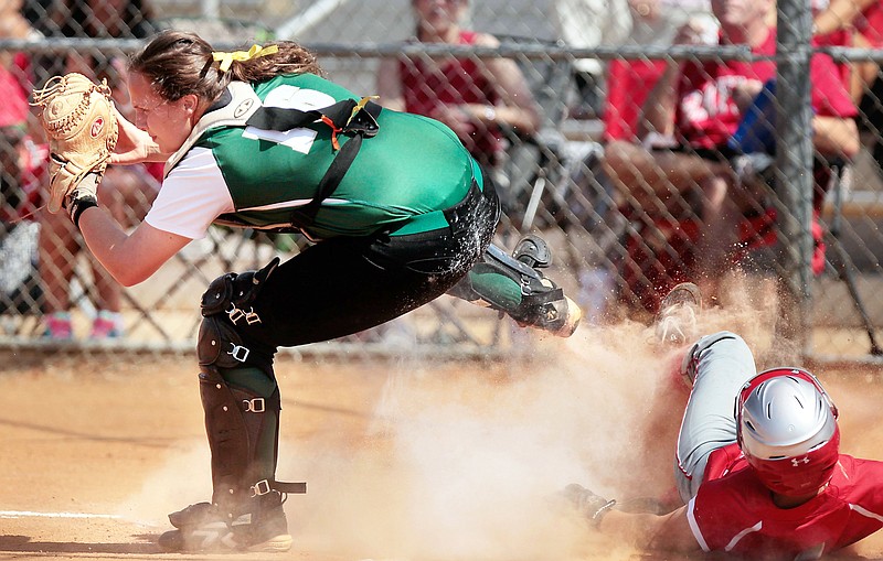 Briarcrest catcher Lauren Provence is late on the tag as Baylor's Sarah Moore slides safe to score during the Spring Fling TSSAA State Tournament in Murfreesboro Wednesday. (Jim Weber/The Commercial Appeal)