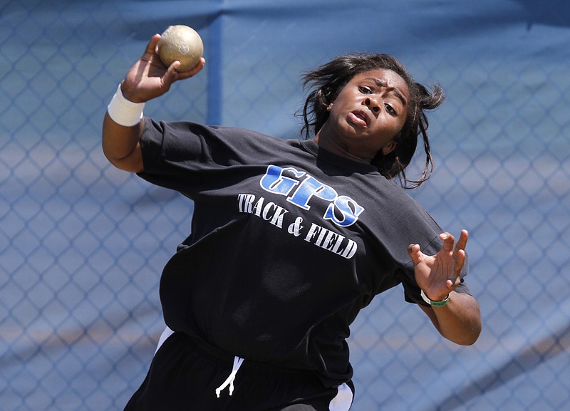 Girls Preparatory School's Simone Busby participates in the shot put during Spring Fling in Murfreesboro, Tenn., on Thursday, May 24, 2012.