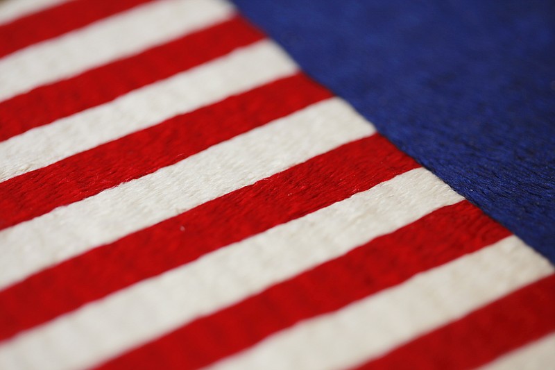 A hand-embroidered vice presidential flag is displayed at the Defense Logistics Agency in Philadelphia. It takes two fabric workers 35 days to complete. About 10 miles from the house where Betsy Ross is believed to have sewn the first U.S. flag, the military supply operation is the sole producers of the hand-stitched presidential banners.