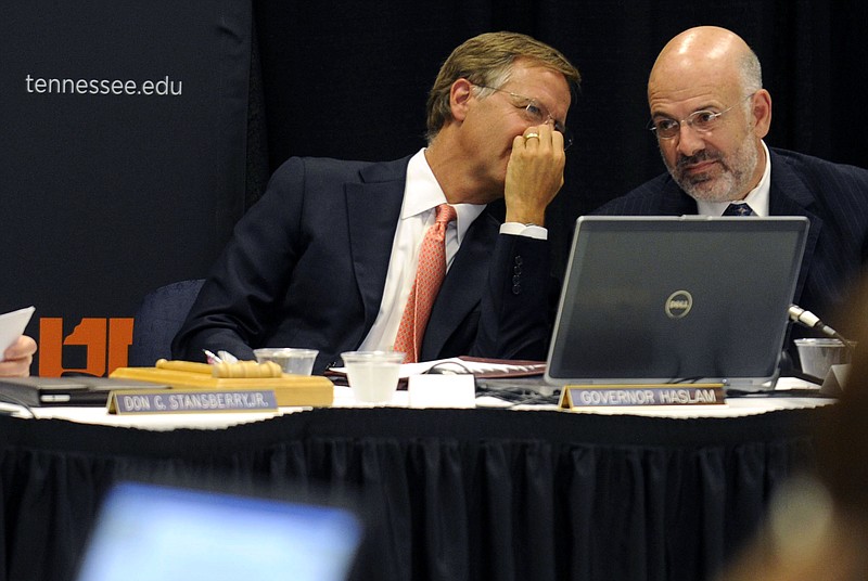 Gov. Bill Haslam, left, talks with UT President Joe DiPietro during a board of trustees meeting Thursday at the University of Tennessee.