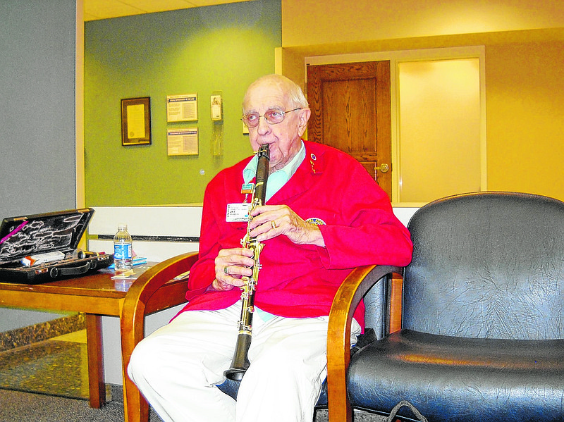 Retired local musician Jay Craven plays his clarinet at Memorial Hospital's downtown campus. From the most requested song, "Amazing Grace," to his own medley of Elvis Presley songs, Craven said he plays it all anywhere in the hospital.