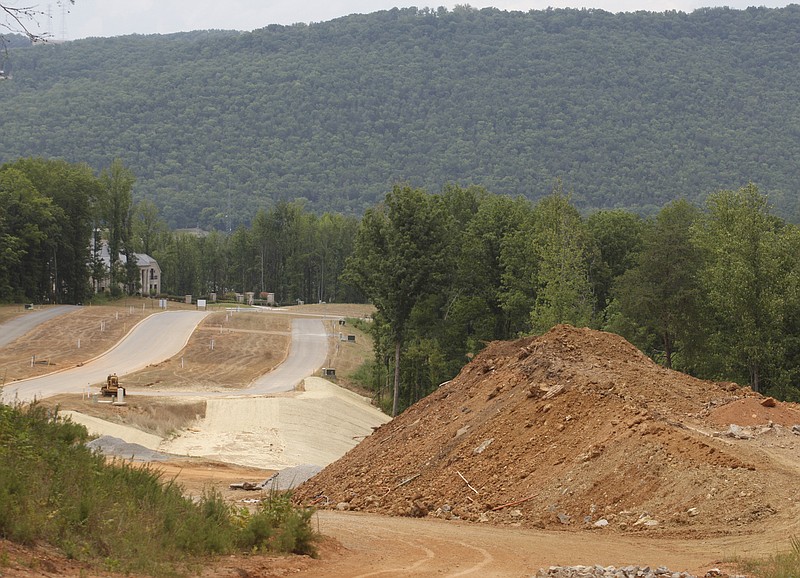 Equipment sits idle around the developing area on Aetna Mountain Road.