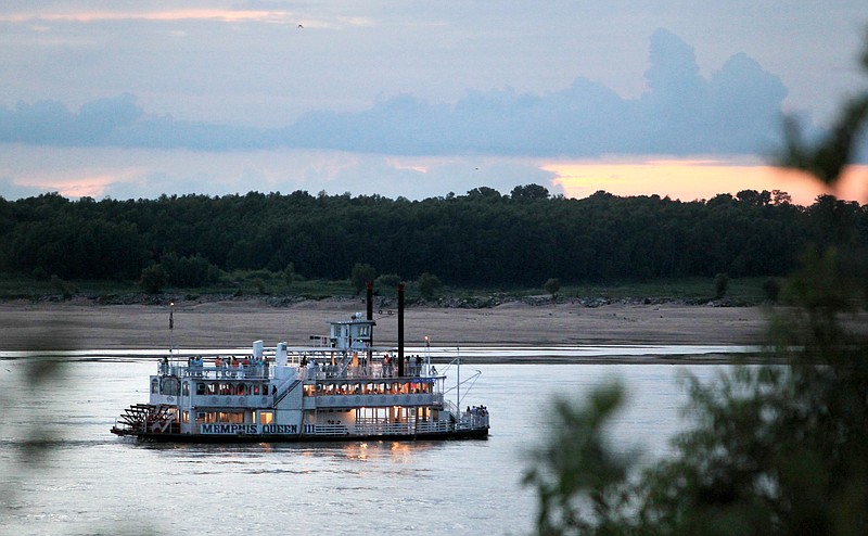 The Memphis Queen riverboat moves up the Mississippi River in Memphis.  A year after nearly record floods, the Mississippi River level has dropped so low that it's beginning to affect commercial operations. Port managers worry that their passages to the river could fill up with silt, and barge operators may have to lighten their loads.