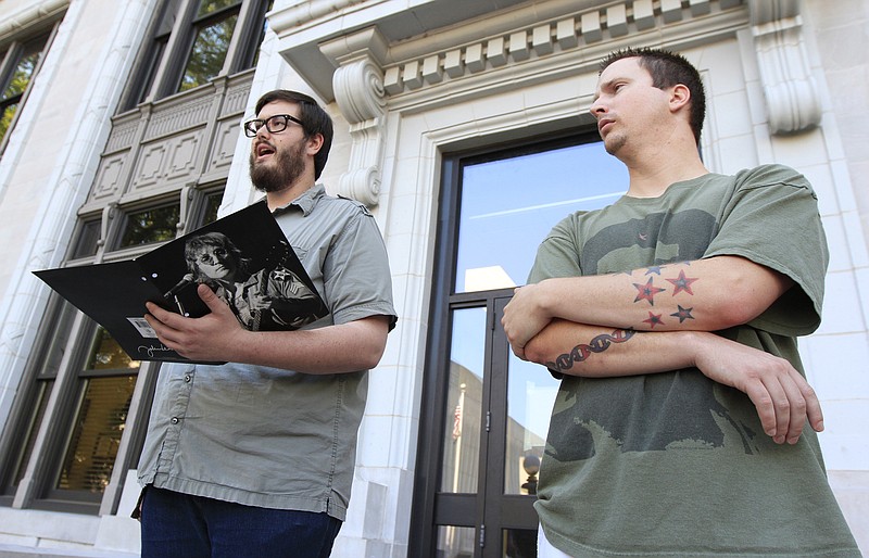 Plaintiffs Brandon Jones, left, and Tommy Coleman, right, lead a rally on the second level of the Hamilton County Courthouse. The group attended the Hamilton County Commission meeting to address commissioners on their belief that a moment of silence should open government meetings  instead of prayer.