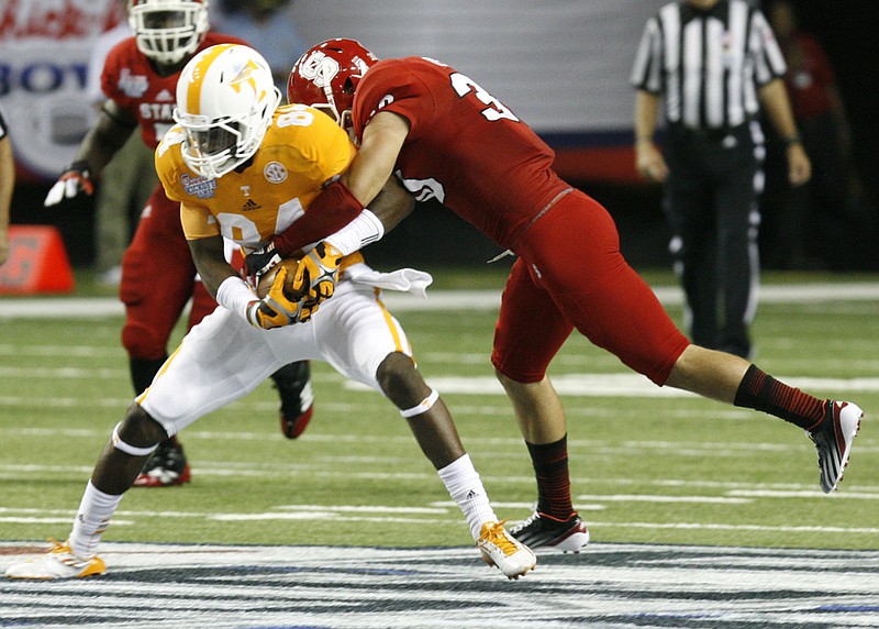 Tennessee junior wide receiver Cordarrelle Patterson carries the ball during the first half of their game against North Carolina State at the Georgia Dome in Atlanta. Tennessee led 22-14 at half time.