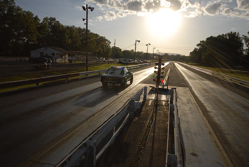 Chattanooga Police Officer Joe Warren leaves the line during a practice run at the Brainerd Optimist Dragstrip in 2010.