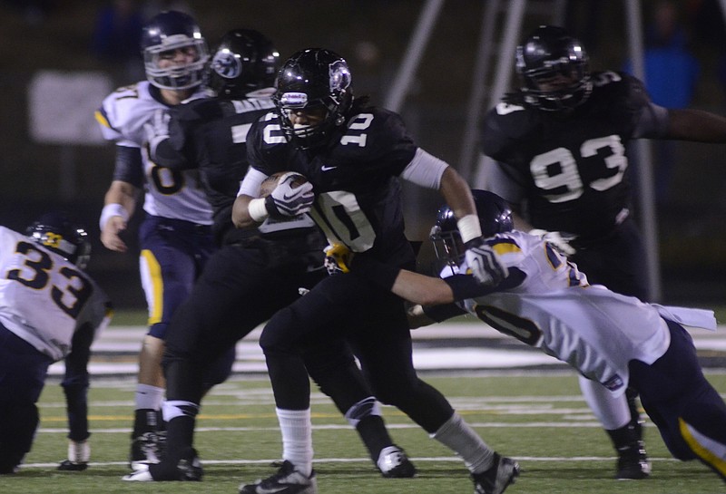 Ridgeland's Darrell Bridges is tackled by Marist's Grant Harrell Friday at Ridgeland.