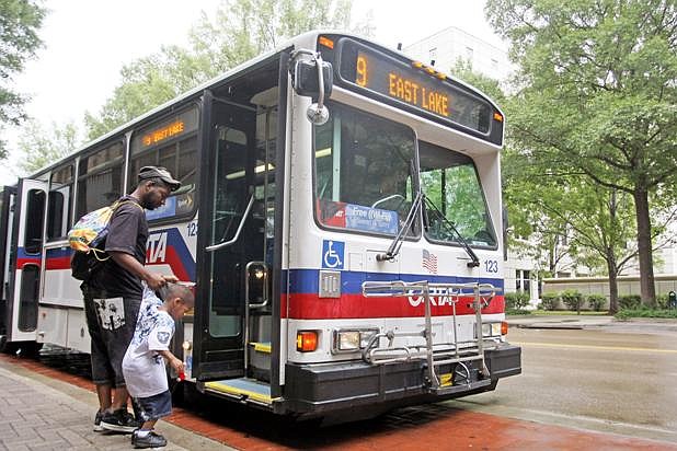 Passengers board a CARTA bus in this file photo.