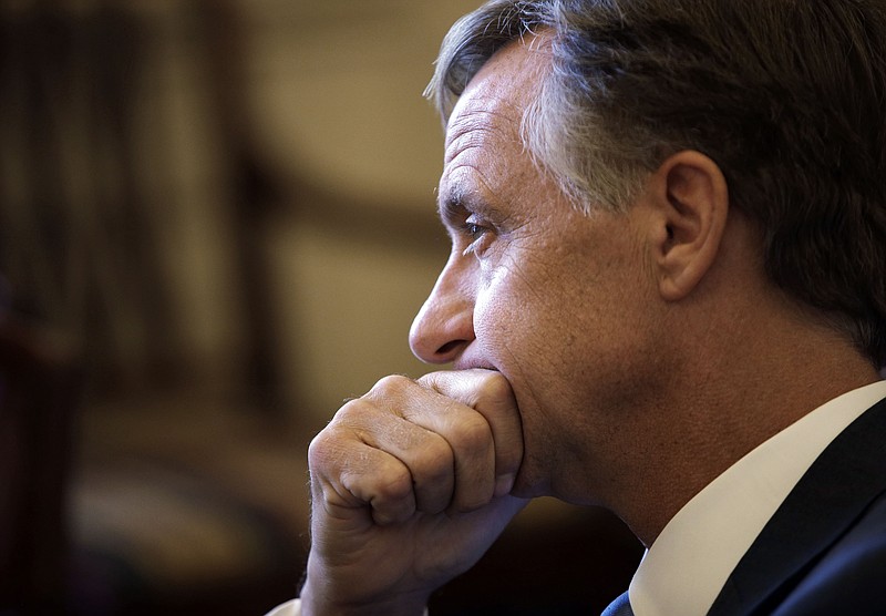 Tennessee Gov. Bill Haslam listens to a question during a news conference after speaking to a joint session of the Legislature on Wednesday in Nashville. Haslam announced that he won't pursue expanding the state's Medicaid program to help cover the uninsured as part of the federal Affordable Care Act.