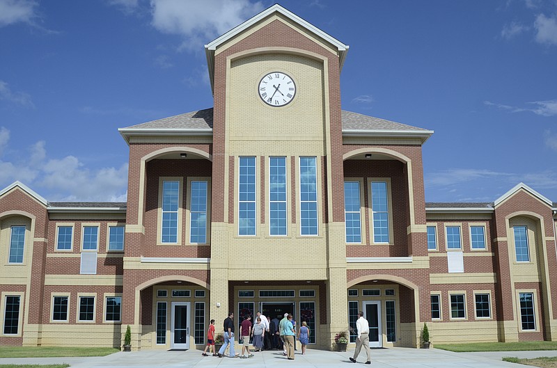Visitors enter Saddle Ridge School in Walker County, Ga., during an open house Tuesday. The two-story masonry building is about 115,000 square feet on 94-plus acres, according to Walker County Schools. The school cost about $15 million, newspaper archives show.