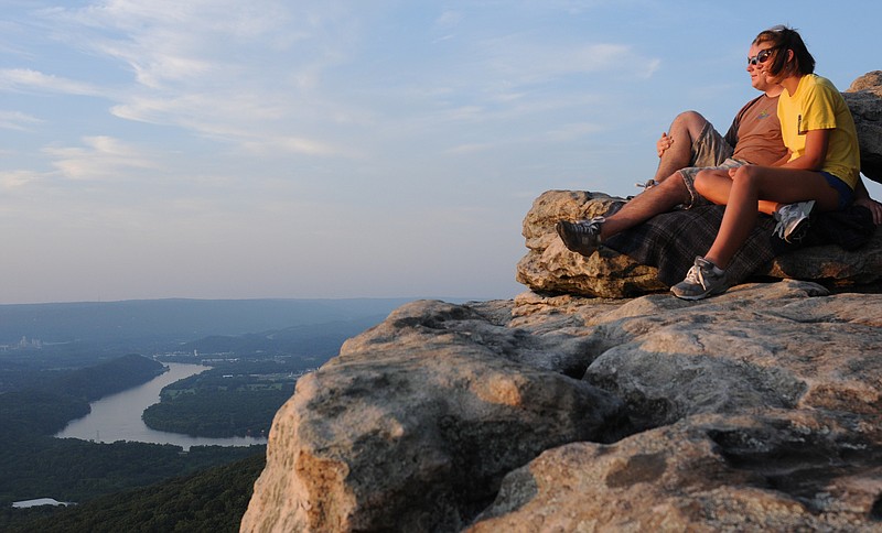 Amber Jones, right, and Dennis Doyle look out over Chattanooga from Sunset Rock.